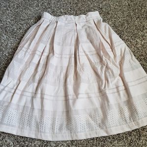 Contemporary skirt, pale pink creme color.